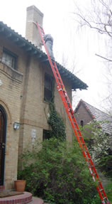Masonry and Concete works employee restoring a chimney in Denver.